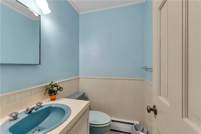 63 Lakeview Dr N, Middlefield, NY 13326 - half bath featuring baseboard heating, toilet, a wainscoted wall, vanity, and ornamental molding