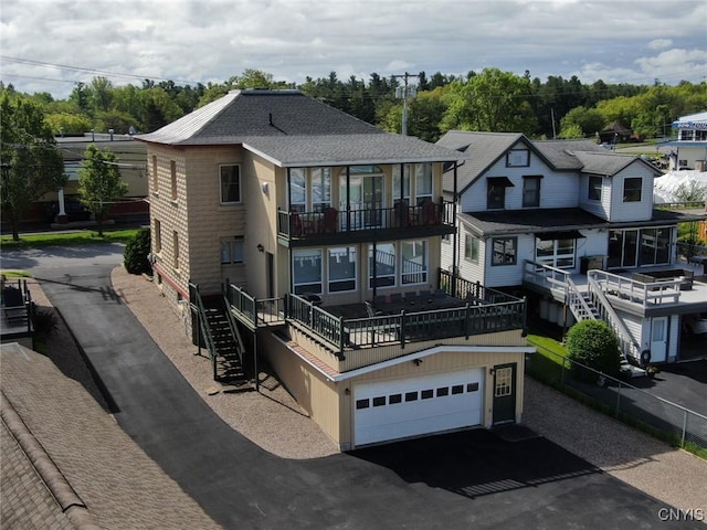 24 Otter St, Alexandria, NY 13607 - view of front facade with driveway and a balcony