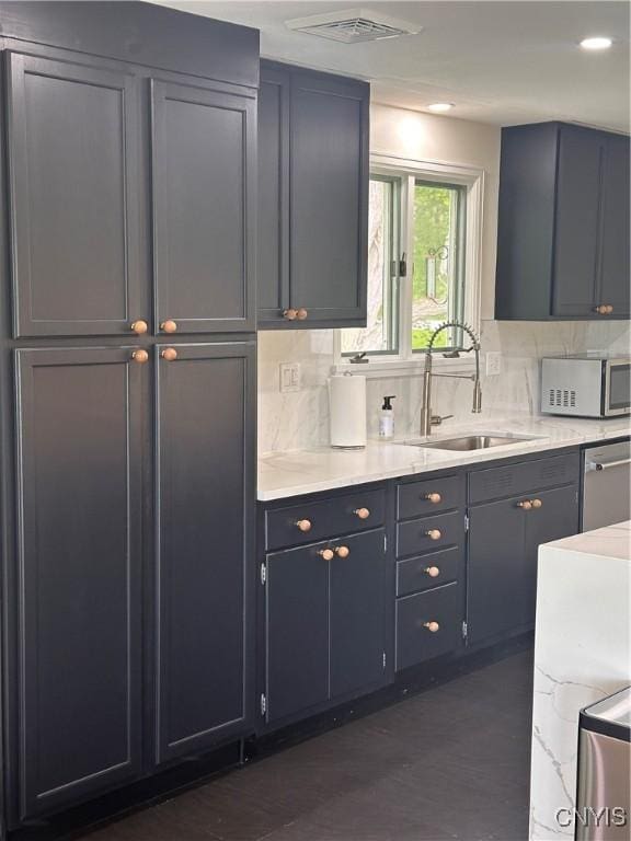 2089 Spring St, Hamilton, NY 13346 - kitchen featuring appliances with stainless steel finishes, a sink, backsplash, light countertops, and recessed lighting