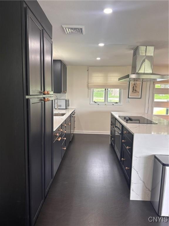 2089 Spring St, Hamilton, NY 13346 - kitchen featuring island range hood, baseboards, black appliances, recessed lighting, and dark flooring