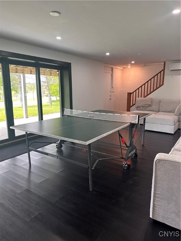 2089 Spring St, Hamilton, NY 13346 - recreation room featuring a wall mounted air conditioner, wood finished floors, and recessed lighting