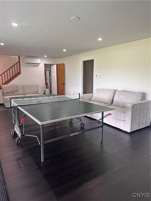 2089 Spring St, Hamilton, NY 13346 - playroom featuring a wall mounted air conditioner, wood finished floors, and recessed lighting