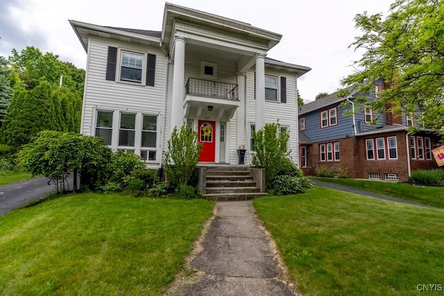 207 Twin Hills Dr, Syracuse, NY 13207 - greek revival house with a balcony and a front lawn