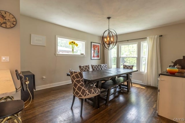 207 Twin Hills Dr, Syracuse, NY 13207 - dining area with dark wood-type flooring, baseboards, and a chandelier
