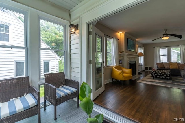 207 Twin Hills Dr, Syracuse, NY 13207 - sunroom with an outdoor living space with a fireplace and a ceiling fan