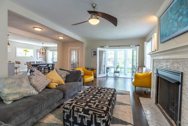 207 Twin Hills Dr, Syracuse, NY 13207 - living room with plenty of natural light, a fireplace, ceiling fan, and wood finished floors