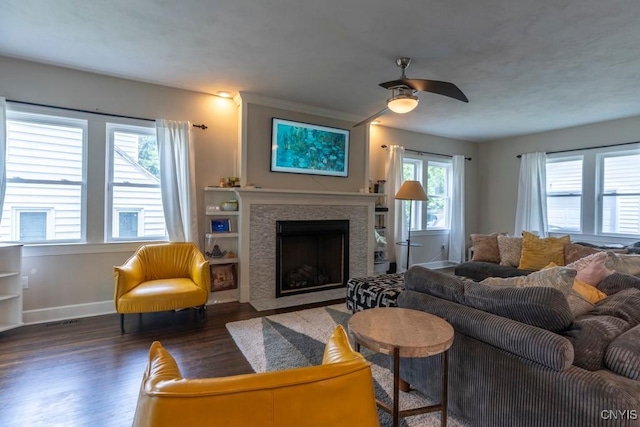 207 Twin Hills Dr, Syracuse, NY 13207 - living area with wood finished floors, baseboards, a ceiling fan, and a fireplace