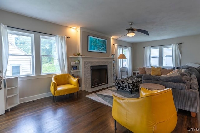 207 Twin Hills Dr, Syracuse, NY 13207 - living area featuring dark wood-style flooring, baseboards, a fireplace with flush hearth, and ceiling fan