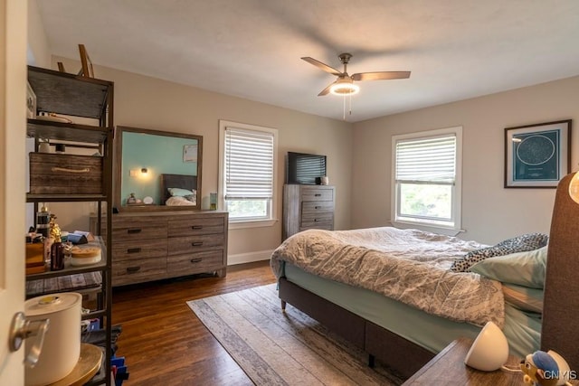 207 Twin Hills Dr, Syracuse, NY 13207 - bedroom with multiple windows, dark wood-type flooring, baseboards, and ceiling fan