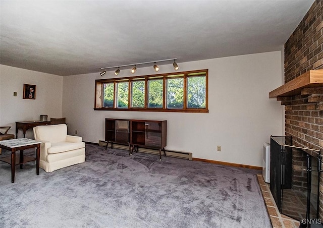 6010 E Lake Rd, Sullivan, NY 13035 - living area with a brick fireplace, carpet floors, rail lighting, and baseboard heating