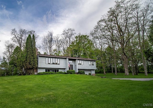 6010 E Lake Rd, Sullivan, NY 13035 - split foyer home with an attached garage and a front yard