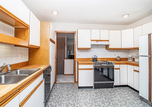 6010 E Lake Rd, Sullivan, NY 13035 - kitchen with range, freestanding refrigerator, a sink, under cabinet range hood, and white cabinetry
