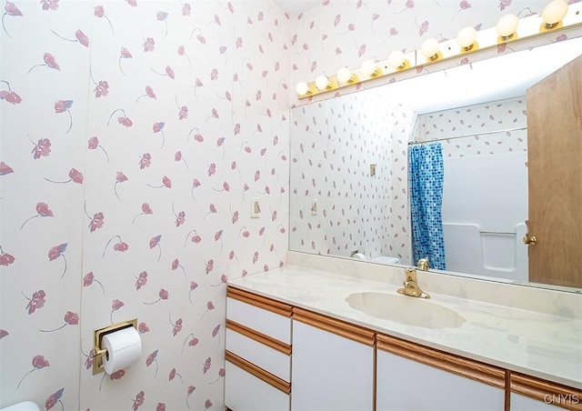 6010 E Lake Rd, Sullivan, NY 13035 - full bath with wallpapered walls, vanity, curtained shower, and toilet