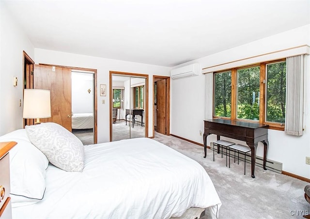 6010 E Lake Rd, Sullivan, NY 13035 - bedroom with a wall mounted air conditioner, two closets, baseboards, carpet flooring, and a baseboard heating unit
