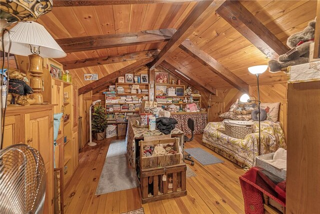 8311 State Route 415, Campbell, NY 14821 - bedroom with wooden walls, wood ceiling, and light wood-style flooring