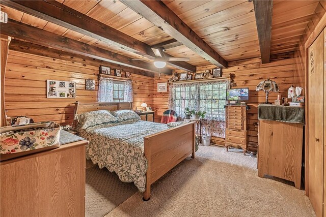8311 State Route 415, Campbell, NY 14821 - bedroom with wooden ceiling with exposed beams, wooden walls, and light carpet