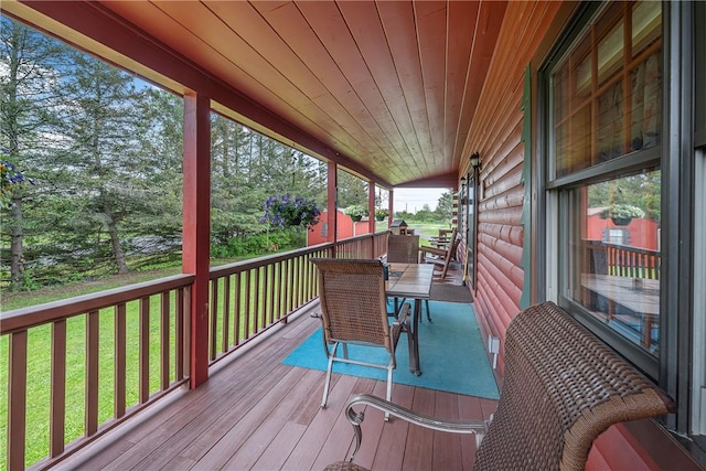 8311 State Route 415, Campbell, NY 14821 - wooden terrace with a lawn and outdoor dining area