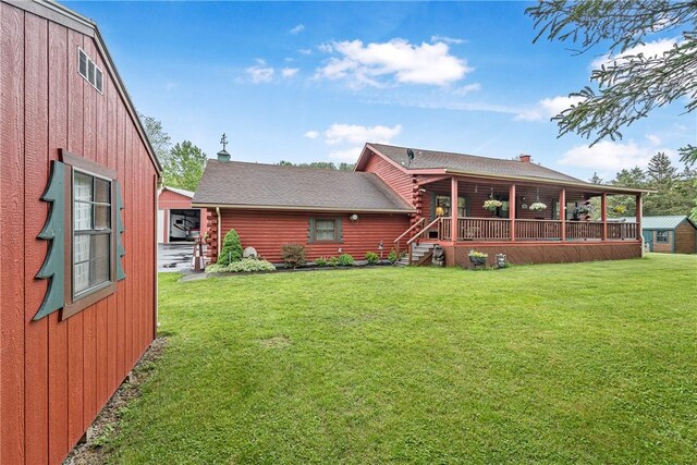 8311 State Route 415, Campbell, NY 14821 - back of house featuring log exterior, a lawn, roof with shingles, and a deck