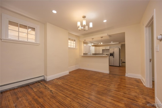 445 Connecticut St, Buffalo, NY 14213 - unfurnished living room with a chandelier, a baseboard radiator, recessed lighting, dark wood finished floors, and baseboards