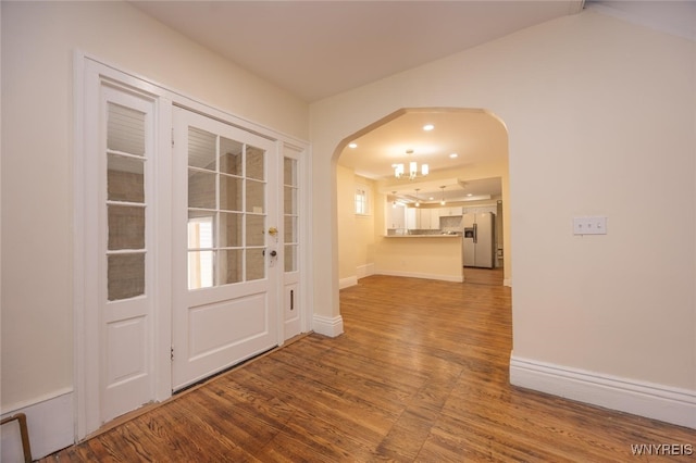 445 Connecticut St, Buffalo, NY 14213 - foyer entrance with arched walkways, wood finished floors, baseboards, and recessed lighting