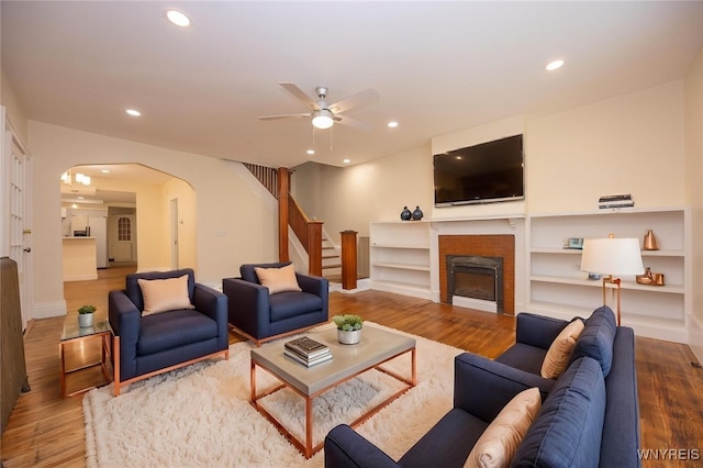 445 Connecticut St, Buffalo, NY 14213 - living room with arched walkways, stairway, ceiling fan, wood finished floors, and recessed lighting