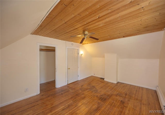 445 Connecticut St, Buffalo, NY 14213 - additional living space with lofted ceiling, ceiling fan, a baseboard heating unit, wood finished floors, and baseboards