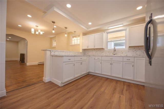445 Connecticut St, Buffalo, NY 14213 - kitchen featuring freestanding refrigerator, a peninsula, light wood finished floors, plenty of natural light, and recessed lighting