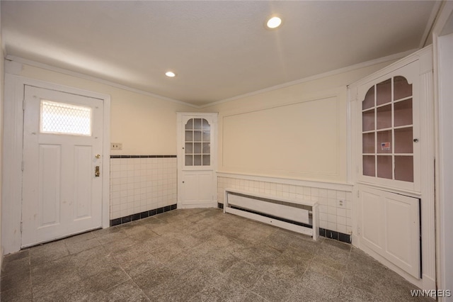 445 Connecticut St, Buffalo, NY 14213 - foyer featuring recessed lighting, a wainscoted wall, ornamental molding, tile walls, and granite floors