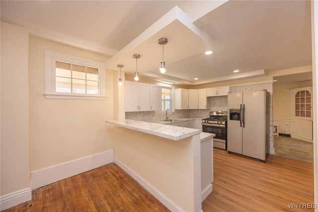 445 Connecticut St, Buffalo, NY 14213 - kitchen with stainless steel range with gas stovetop, refrigerator with ice dispenser, a sink, a peninsula, and light wood-style floors