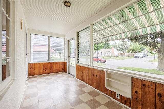 40 Mcnaughton St, Rochester, NY 14606 - unfurnished sunroom featuring tile patterned floors and wooden walls