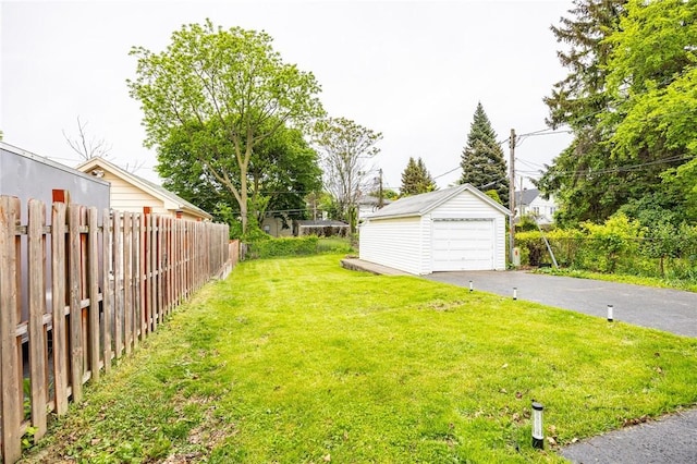 40 Mcnaughton St, Rochester, NY 14606 - view of yard with an outbuilding, a detached garage, and asphalt driveway
