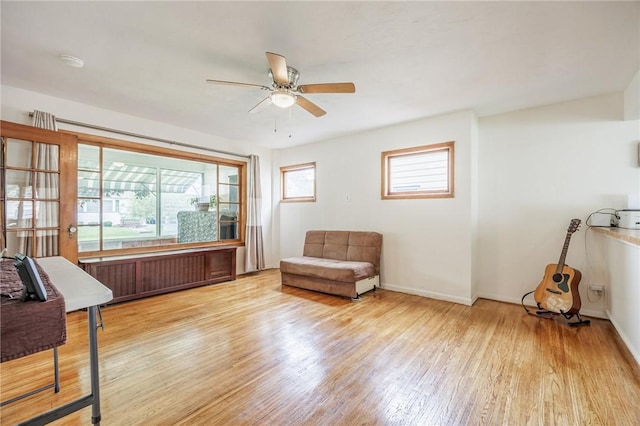 40 Mcnaughton St, Rochester, NY 14606 - sitting room featuring radiator heating unit, a ceiling fan, wood finished floors, and baseboards