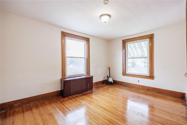 40 Mcnaughton St, Rochester, NY 14606 - spare room with radiator, light wood-type flooring, and baseboards