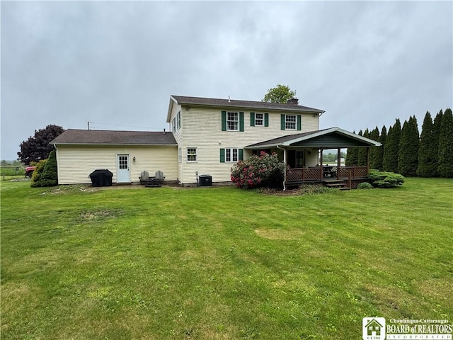 8900 Brownell Rd, Clymer, NY 14724 - rear view of property with a yard, a porch, central air condition unit, and a chimney
