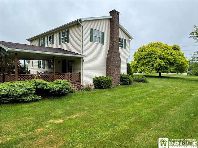 8900 Brownell Rd, Clymer, NY 14724 - view of home's exterior with a chimney and a yard