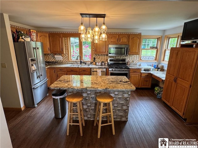8900 Brownell Rd, Clymer, NY 14724 - kitchen with stainless steel appliances, a sink, dark wood-style flooring, and a kitchen island