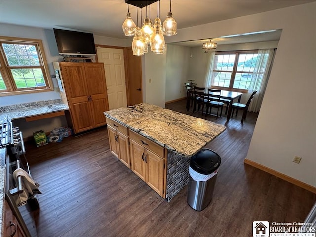 8900 Brownell Rd, Clymer, NY 14724 - kitchen with dark wood-type flooring, light stone countertops, a chandelier, hanging light fixtures, and a kitchen island