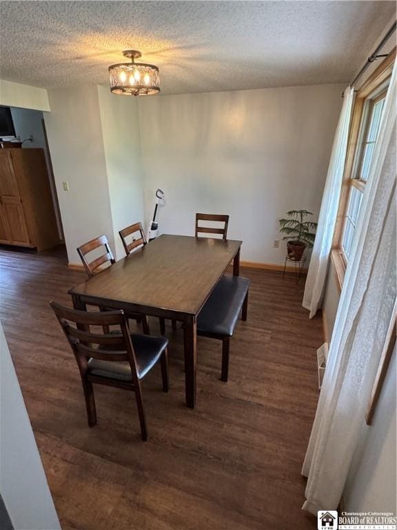 8900 Brownell Rd, Clymer, NY 14724 - dining area with a textured ceiling, wood finished floors, baseboards, and a chandelier