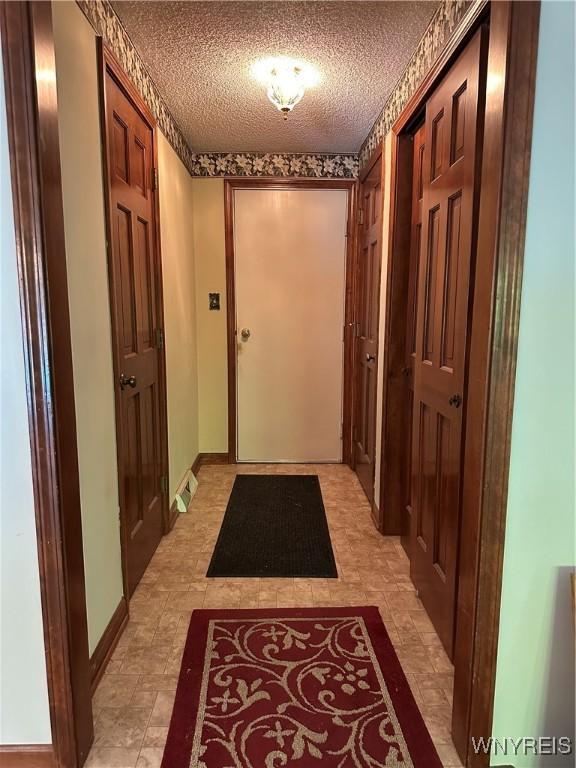 55 Hemlock Ln, Lancaster, NY 14086 - corridor with a textured ceiling