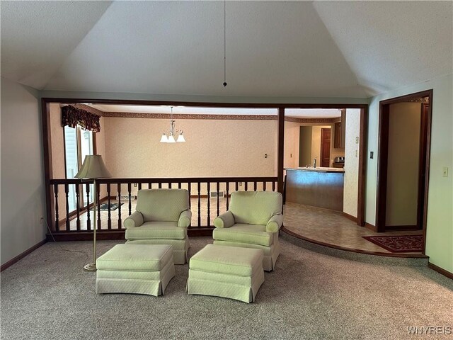 55 Hemlock Ln, Lancaster, NY 14086 - sitting room featuring vaulted ceiling, carpet flooring, baseboards, and a chandelier