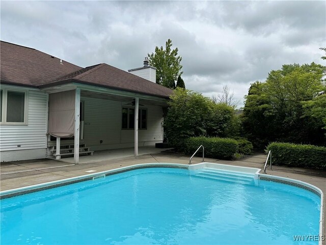 55 Hemlock Ln, Lancaster, NY 14086 - swimming pool with a patio, ceiling fan, and entry steps