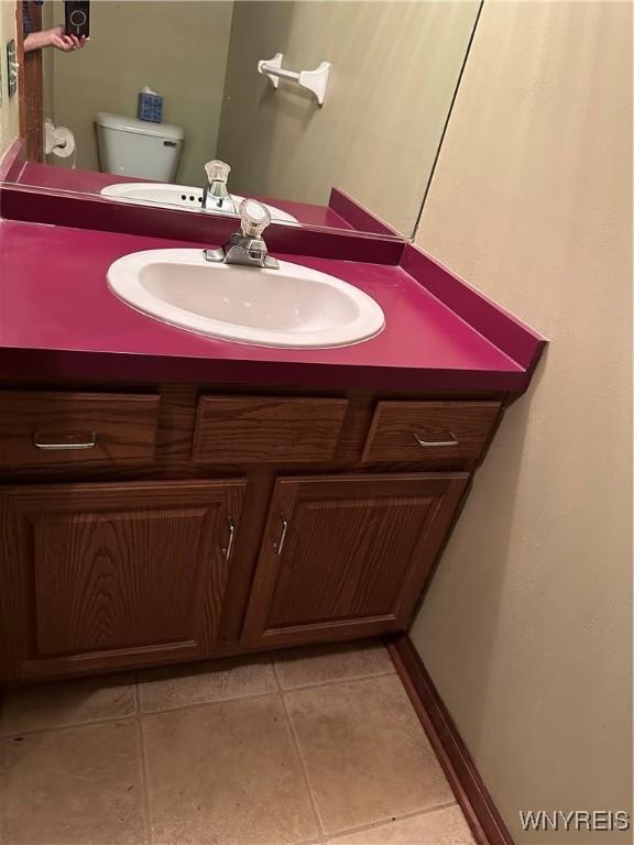 55 Hemlock Ln, Lancaster, NY 14086 - bathroom featuring vanity, toilet, and tile patterned flooring
