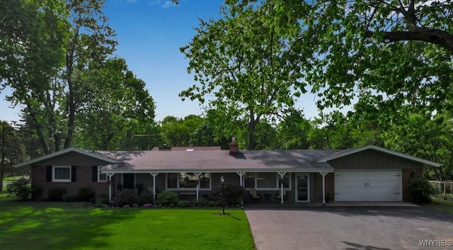 4710 Boncrest Dr E, Clarence, NY 14221 - single story home with an attached garage, driveway, a front lawn, and a chimney