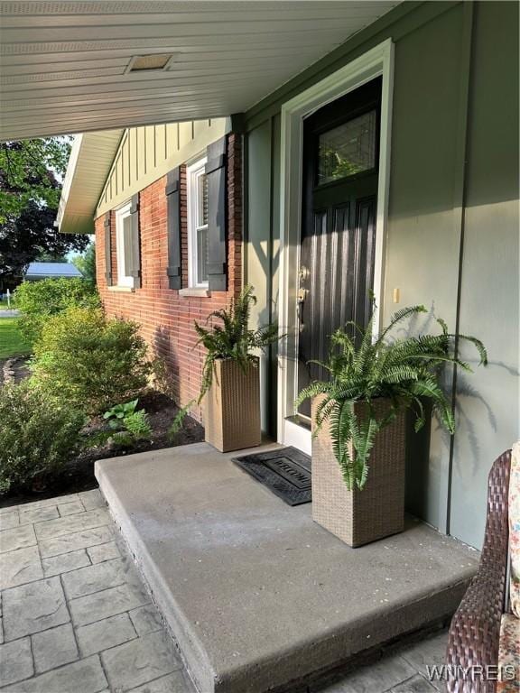 4710 Boncrest Dr E, Clarence, NY 14221 - doorway to property featuring brick siding