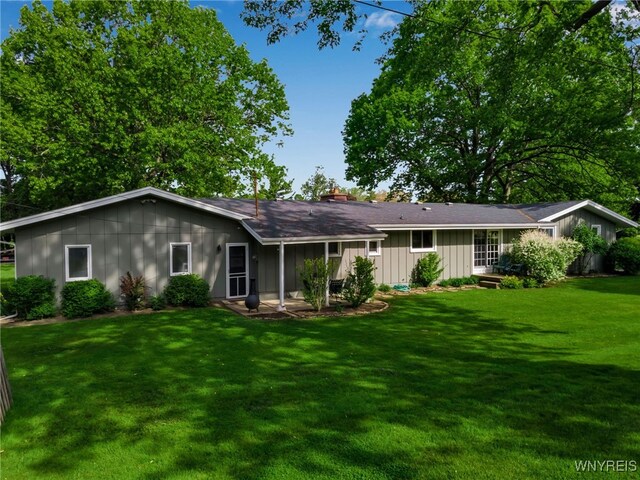 4710 Boncrest Dr E, Clarence, NY 14221 - back of property with board and batten siding and a yard