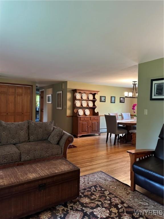 4710 Boncrest Dr E, Clarence, NY 14221 - living area featuring light wood-style floors and a chandelier