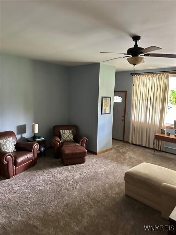 4710 Boncrest Dr E, Clarence, NY 14221 - carpeted living area featuring ceiling fan and baseboards