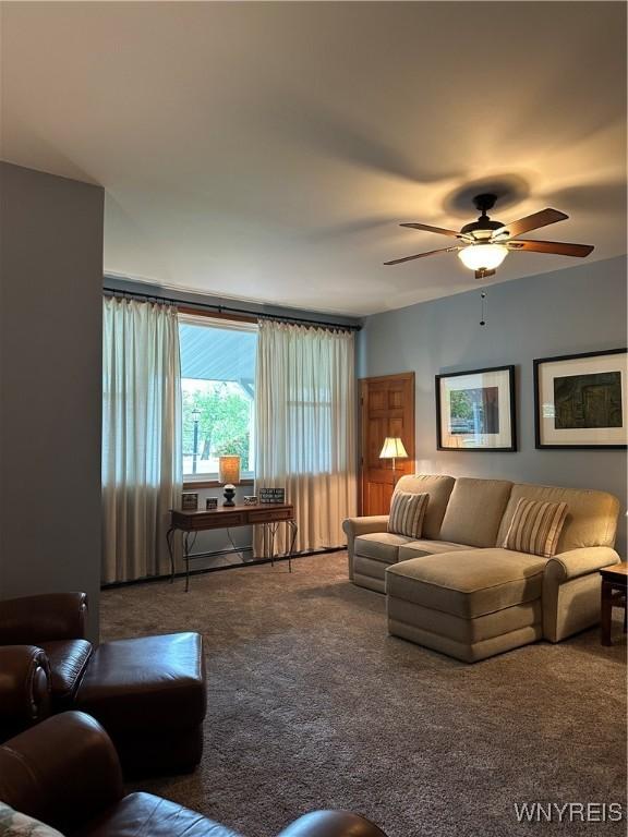 4710 Boncrest Dr E, Clarence, NY 14221 - carpeted living area with ceiling fan