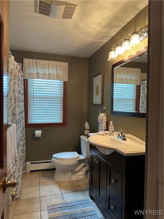 4710 Boncrest Dr E, Clarence, NY 14221 - full bath featuring baseboard heating, vanity, toilet, tile patterned floors, and healthy amount of natural light