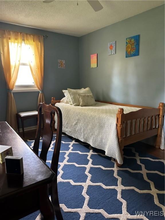 4710 Boncrest Dr E, Clarence, NY 14221 - bedroom with a textured ceiling and a ceiling fan